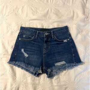 dark wash guess jean shorts with a few rips